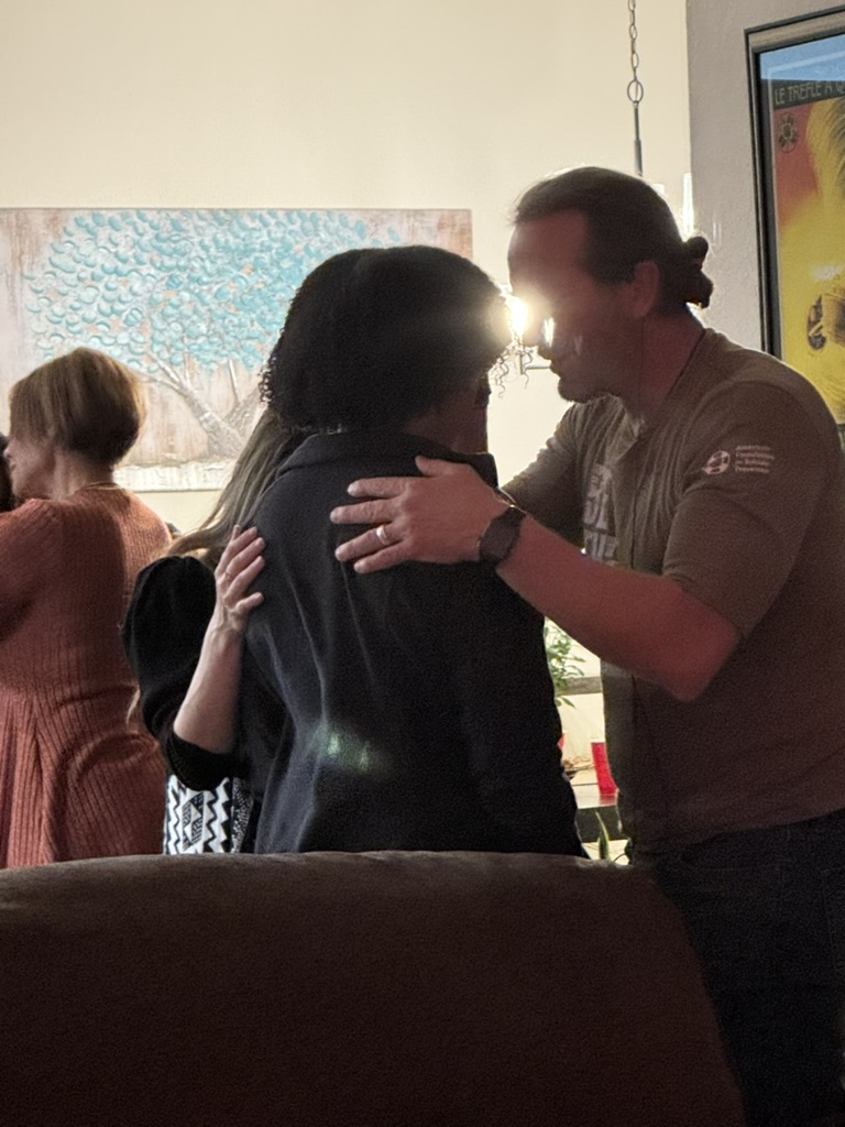 Prayer ministry in a living room gathering